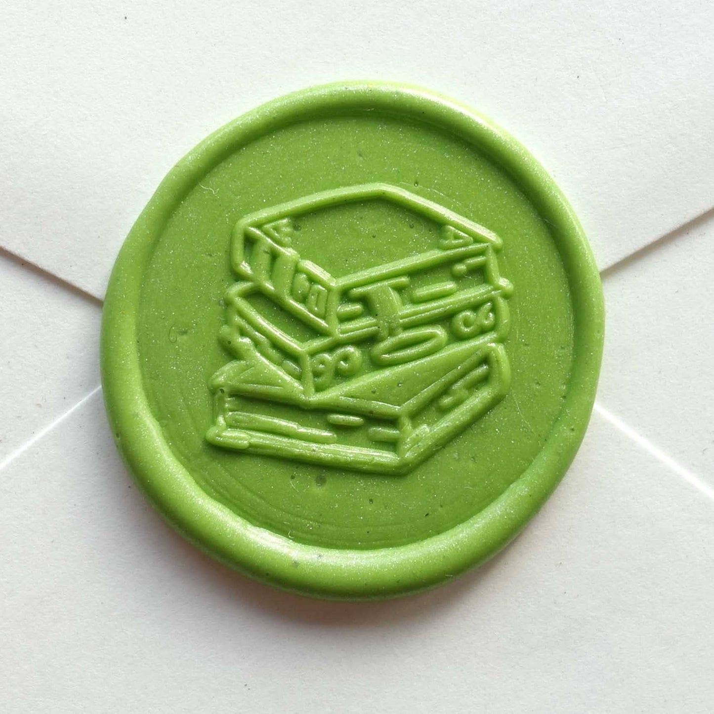 Wax Seal Stamp; Stack of Books